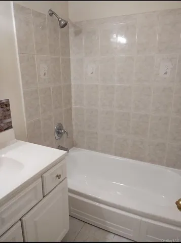 a bathroom with a sink a bathtub and a shower