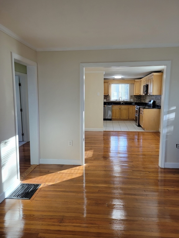 31 Avalon Avenue, Unit 1 Quincy, MA 02169 - Photo 5 of 10 a view of empty room with wooden floor