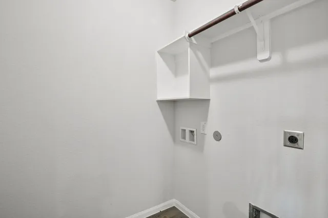 an empty room with a ceiling fan and a window