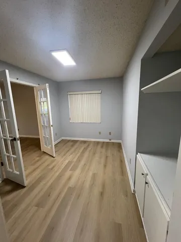 a view of empty room with a fireplace