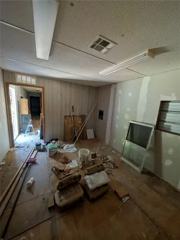 a room with furniture and a wooden floor