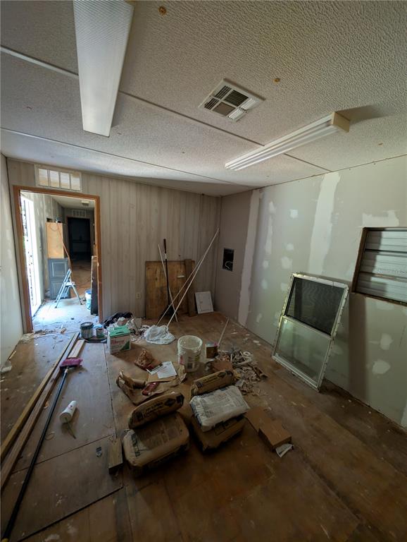 109 Rhododendron Lane Interlachen, FL 32148 - Photo 6 of 7 a room with furniture and a wooden floor