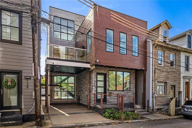 a front view of a brick building with a entrance