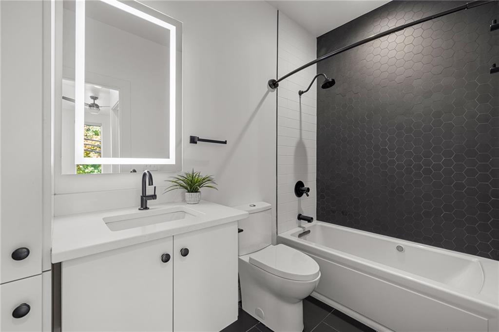 127 1/2 Banner Way Pittsburgh, PA 15201 - Photo 17 of 48 a bathroom with a sink a toilet and shower