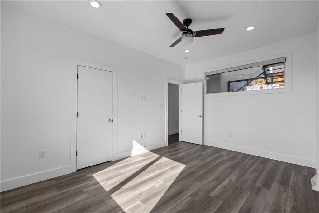 127 1/2 Banner Way Pittsburgh, PA 15201 - Photo 19 of 48 a view of a livingroom with a ceiling fan & wooden floor