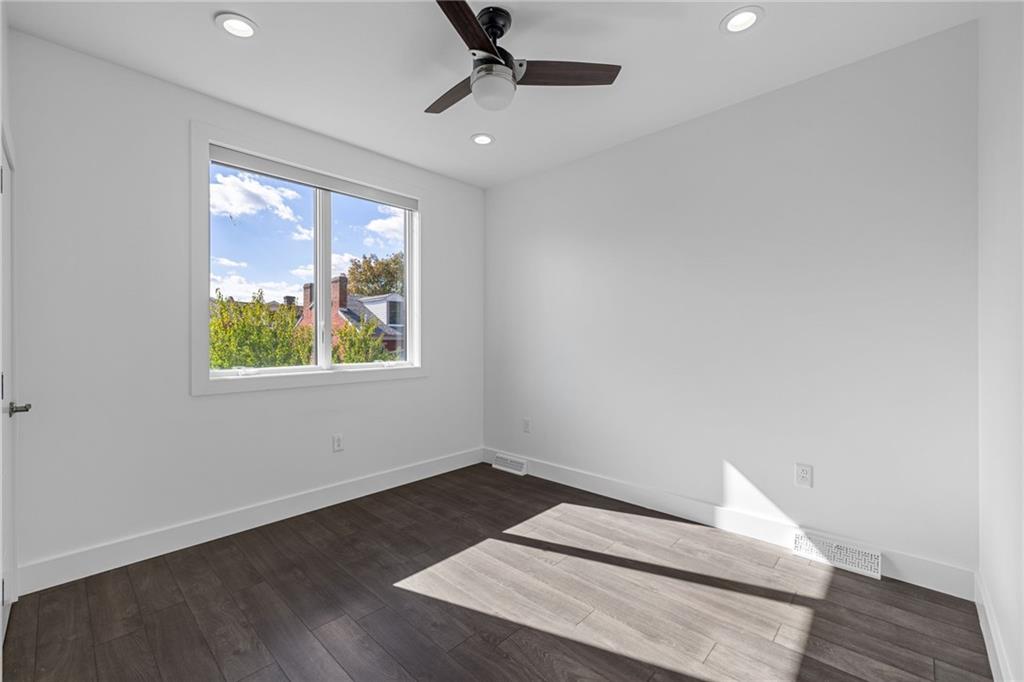 127 1/2 Banner Way Pittsburgh, PA 15201 - Photo 21 of 48 wooden floor in an empty room with a window