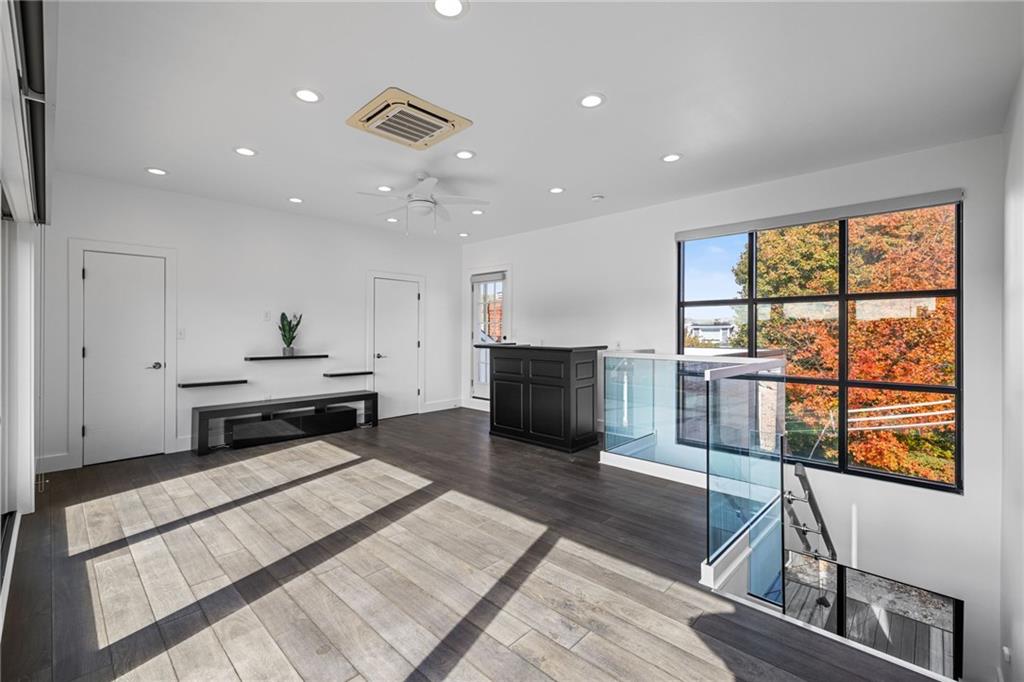 127 1/2 Banner Way Pittsburgh, PA 15201 - Photo 26 of 48 a kitchen with stainless steel appliances granite countertop lots of counter top space and wooden floor