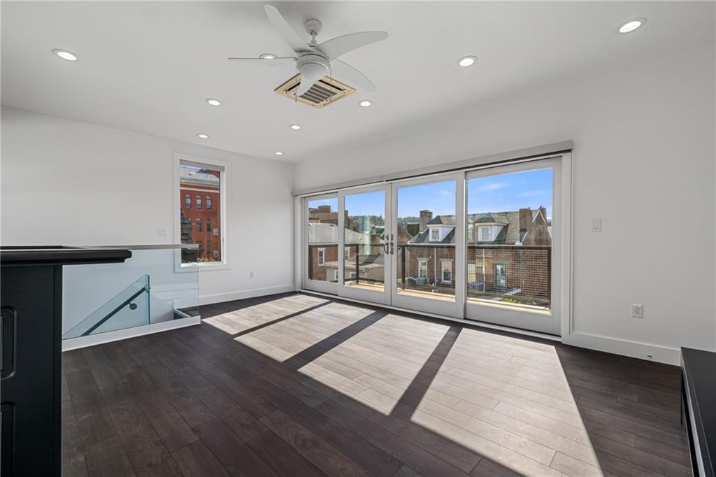 127 1/2 Banner Way Pittsburgh, PA 15201 - Photo 27 of 48 a view of an empty room with a window and wooden floor