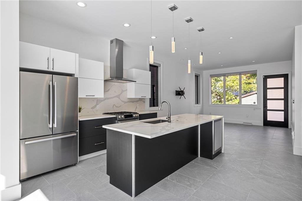 127 1/2 Banner Way Pittsburgh, PA 15201 - Photo 7 of 48 a kitchen with a sink stainless steel appliances and window