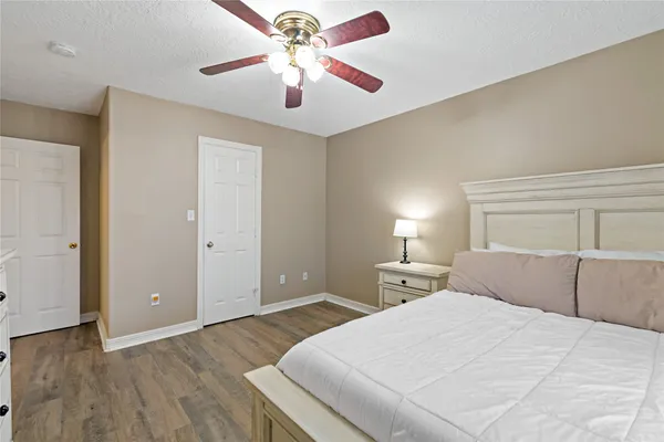 a bedroom with a bed and a dresser