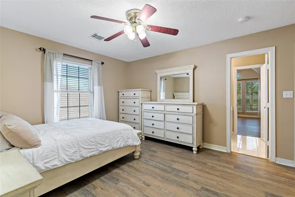 a bedroom with a bed and a couch