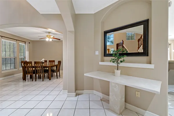 a view of dining room kitchen with table and chairs