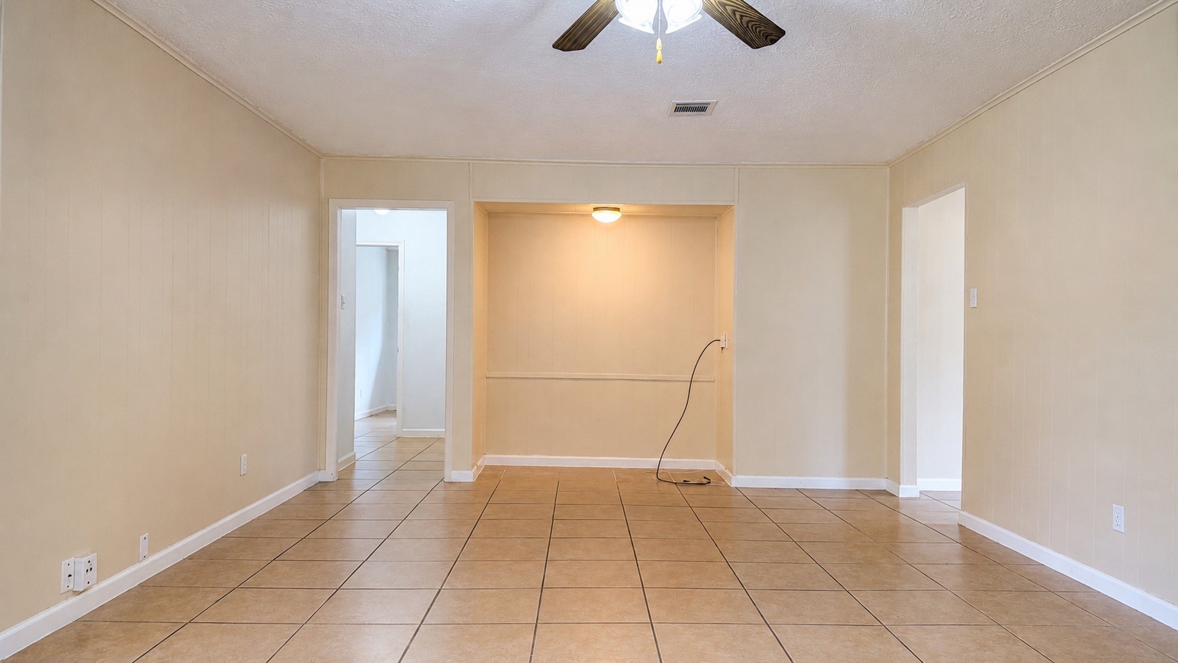 4418 Ponca Street Pasadena, TX 77504 - Photo 11 of 23 Another look at the living space and its easy flow into nearby rooms. (image has been enhance for marketing purposes)