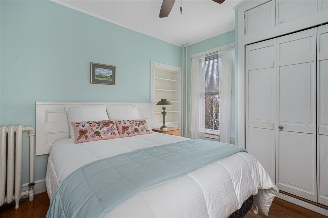 8 Everett Street, Unit 2 Newport, RI 02840 - Photo 18 of 29 Bedroom #2 with built-in wall shelving and cedar closet