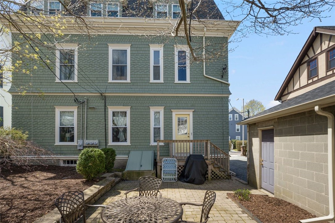 8 Everett Street, Unit 2 Newport, RI 02840 - Photo 26 of 29 Patio with the garage to the right