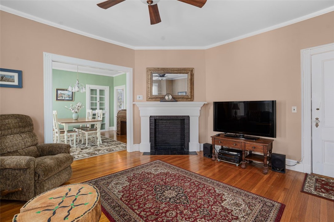 8 Everett Street, Unit 2 Newport, RI 02840 - Photo 8 of 29 Living room with a lovely wood mantle, open to the dining room
