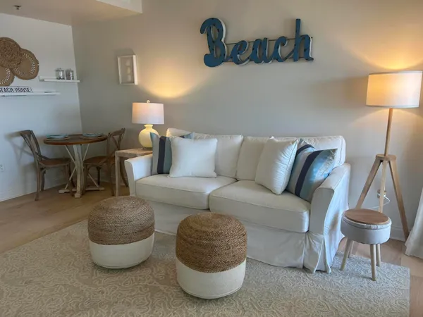 a living room with furniture and a lamp