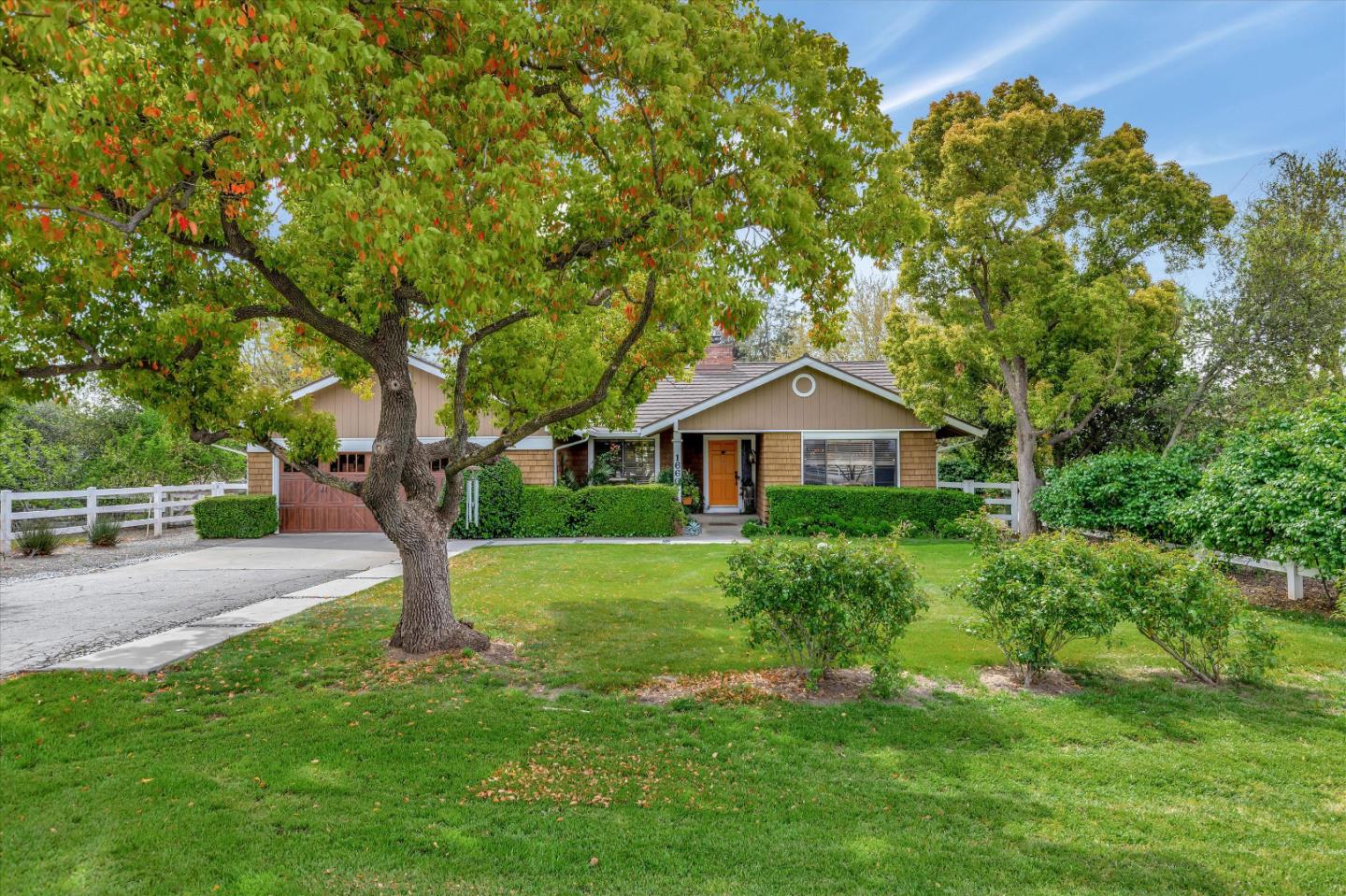 1660 Eberts Drive San Martin, CA 95046 - Photo 1 of 77 a front view of a house with a yard and trees