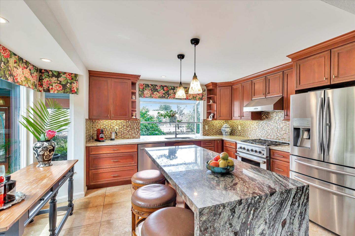 1660 Eberts Drive San Martin, CA 95046 - Photo 14 of 77 a kitchen with stainless steel appliances granite countertop a sink a stove and a refrigerator