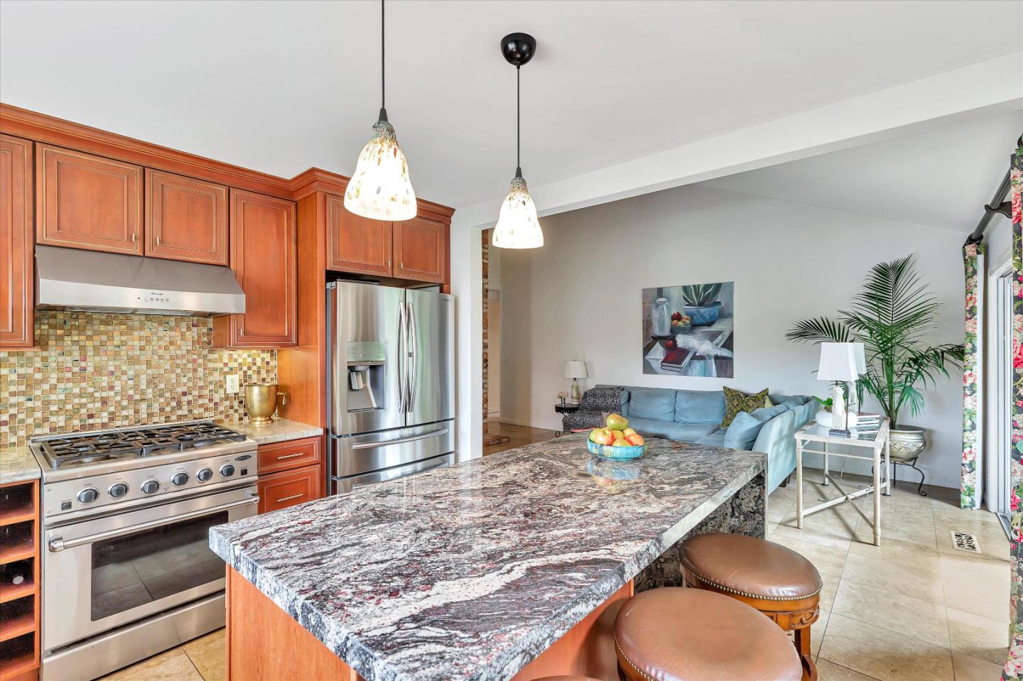 1660 Eberts Drive San Martin, CA 95046 - Photo 15 of 77 a kitchen with a table chairs stove and refrigerator