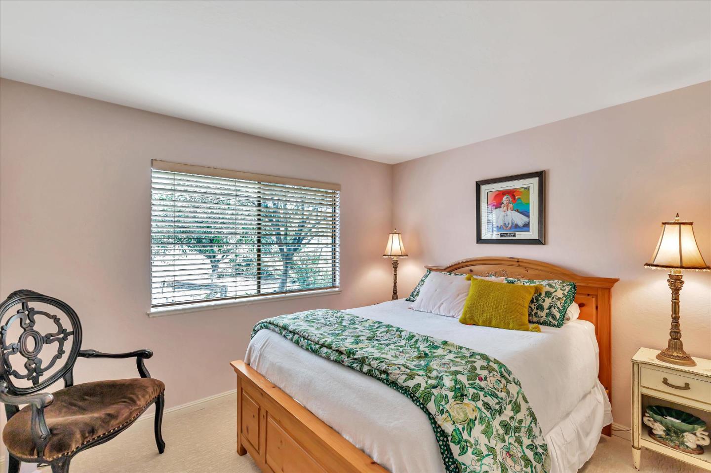 1660 Eberts Drive San Martin, CA 95046 - Photo 21 of 77 a bedroom with a bed a dresser next to a window