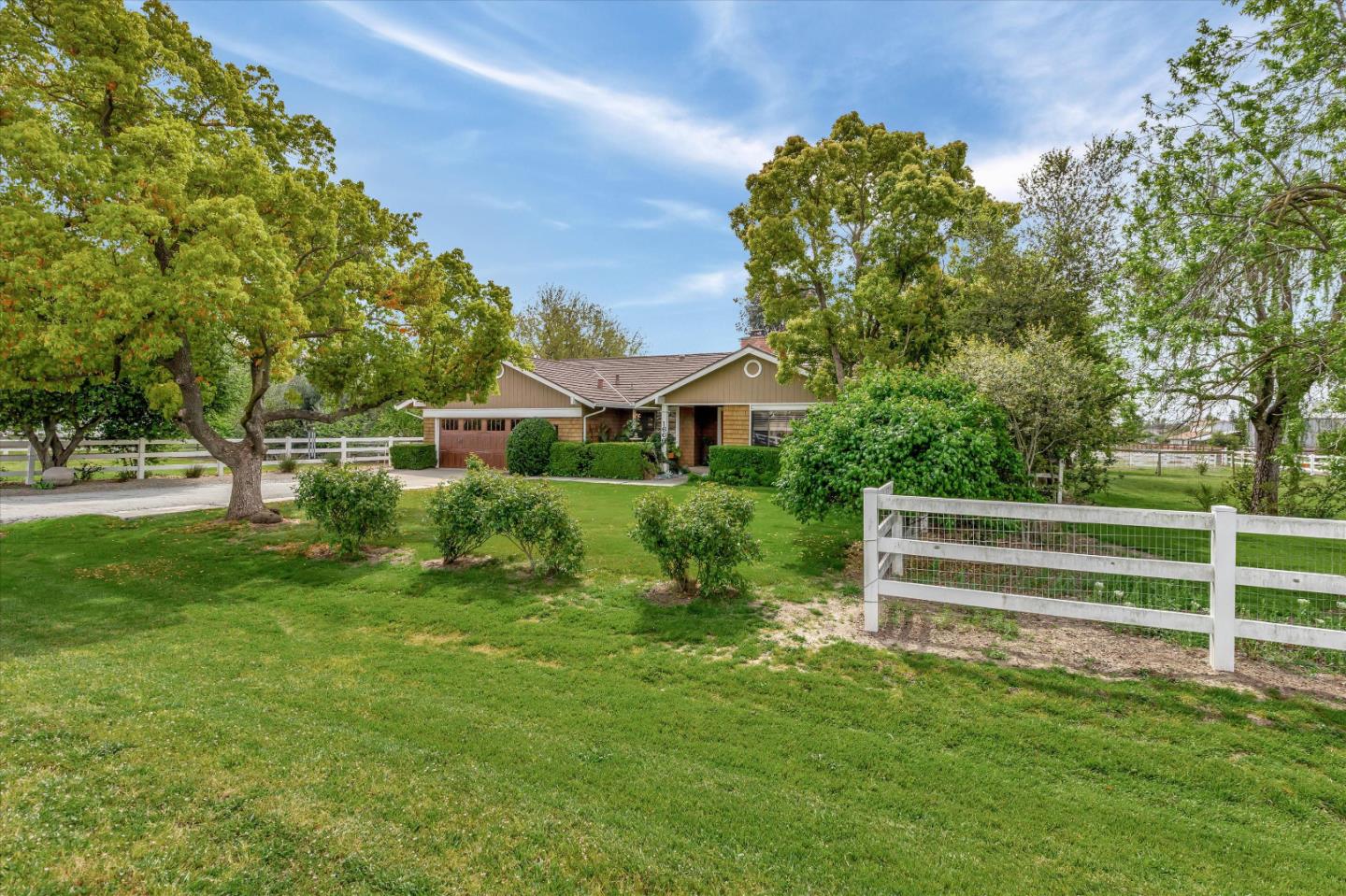 1660 Eberts Drive San Martin, CA 95046 - Photo 3 of 77 a front view of a house with a yard