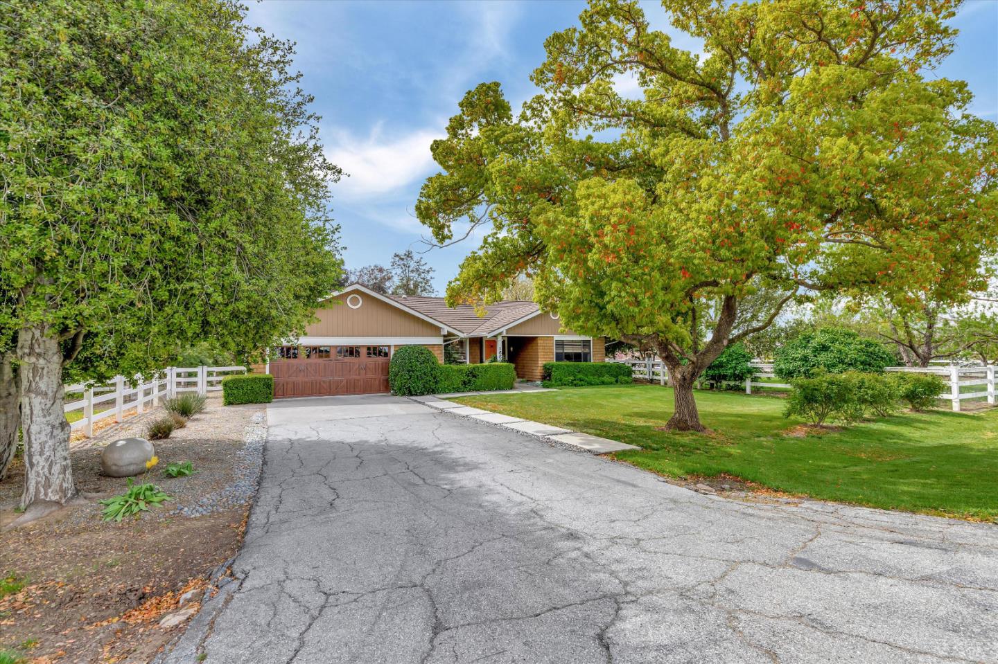 1660 Eberts Drive San Martin, CA 95046 - Photo 4 of 77 a view of a house with a yard and large trees