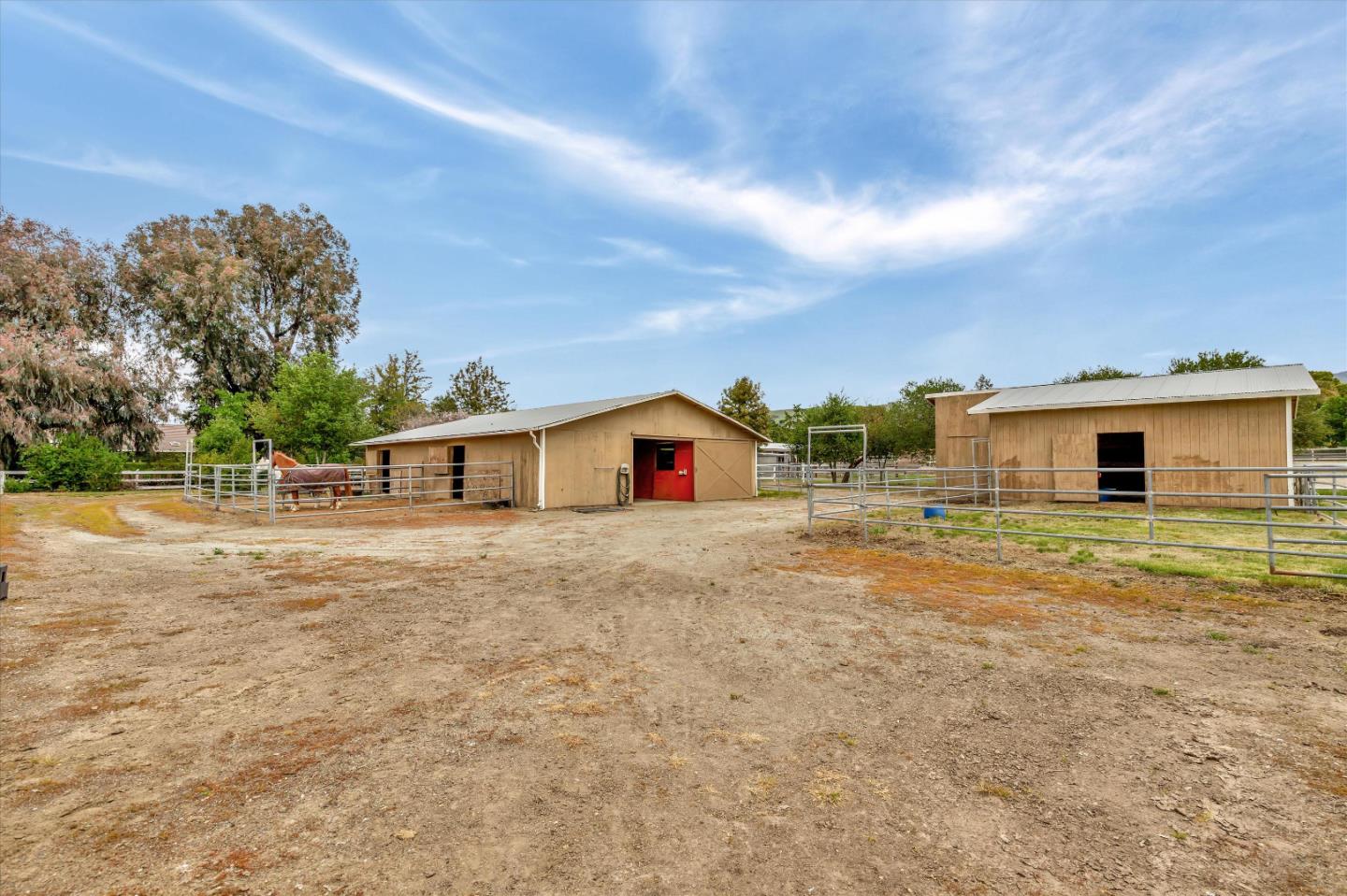1660 Eberts Drive San Martin, CA 95046 - Photo 53 of 77 a front view of house with yard and trees in the background