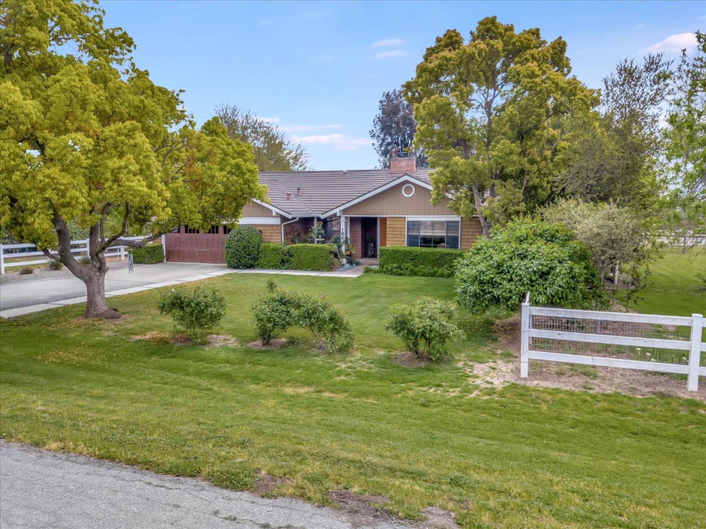 1660 Eberts Drive San Martin, CA 95046 - Photo 65 of 77 a yellow and red house with a garden