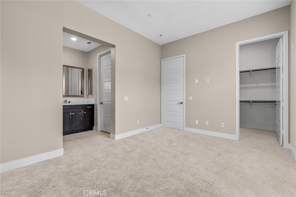 111 Drama Irvine, CA 92618 - Photo 11 of 28 an empty room with closet and windows