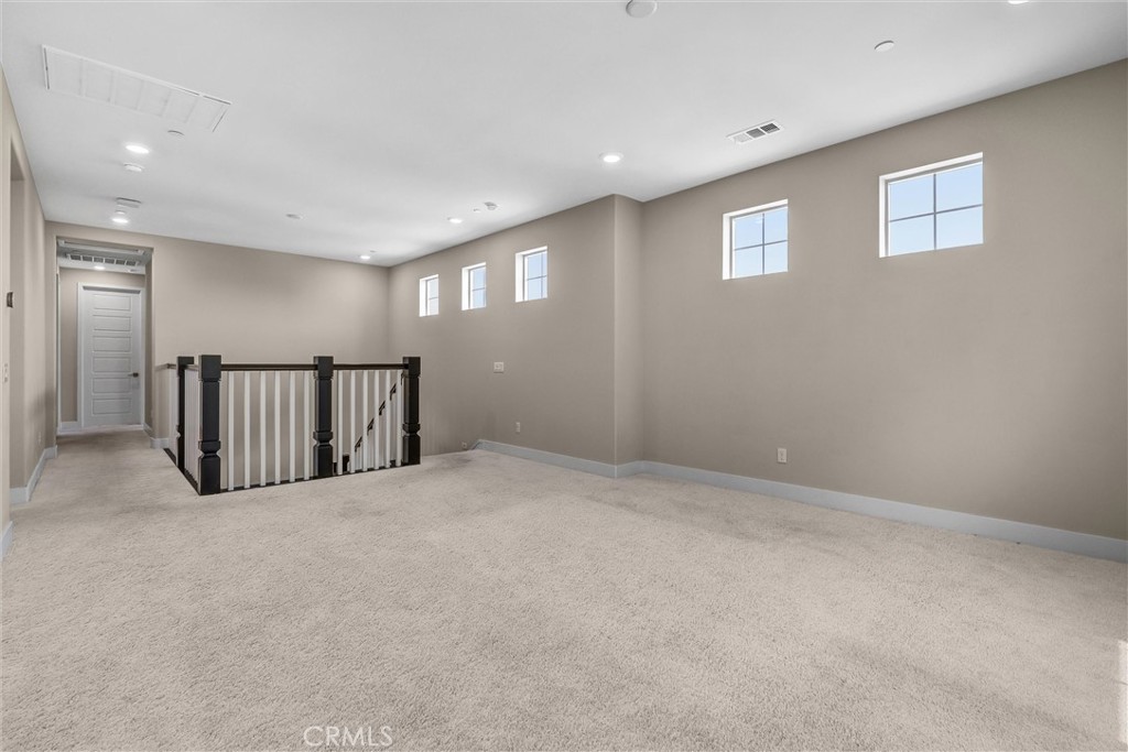 111 Drama Irvine, CA 92618 - Photo 14 of 28 a view of an empty room with windows