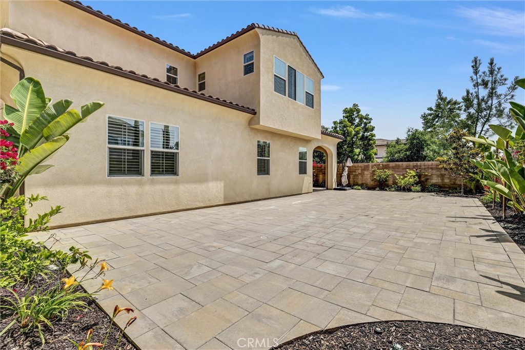 111 Drama Irvine, CA 92618 - Photo 26 of 28 a view of a white house with a yard