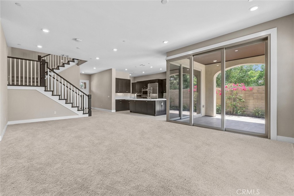 111 Drama Irvine, CA 92618 - Photo 3 of 28 a view of an empty room with a sliding door and windows