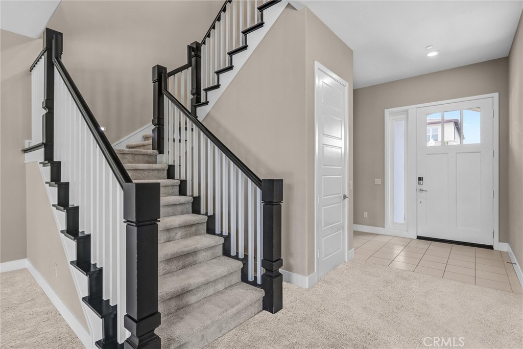111 Drama Irvine, CA 92618 - Photo 9 of 28 a view of an entryway with staircase