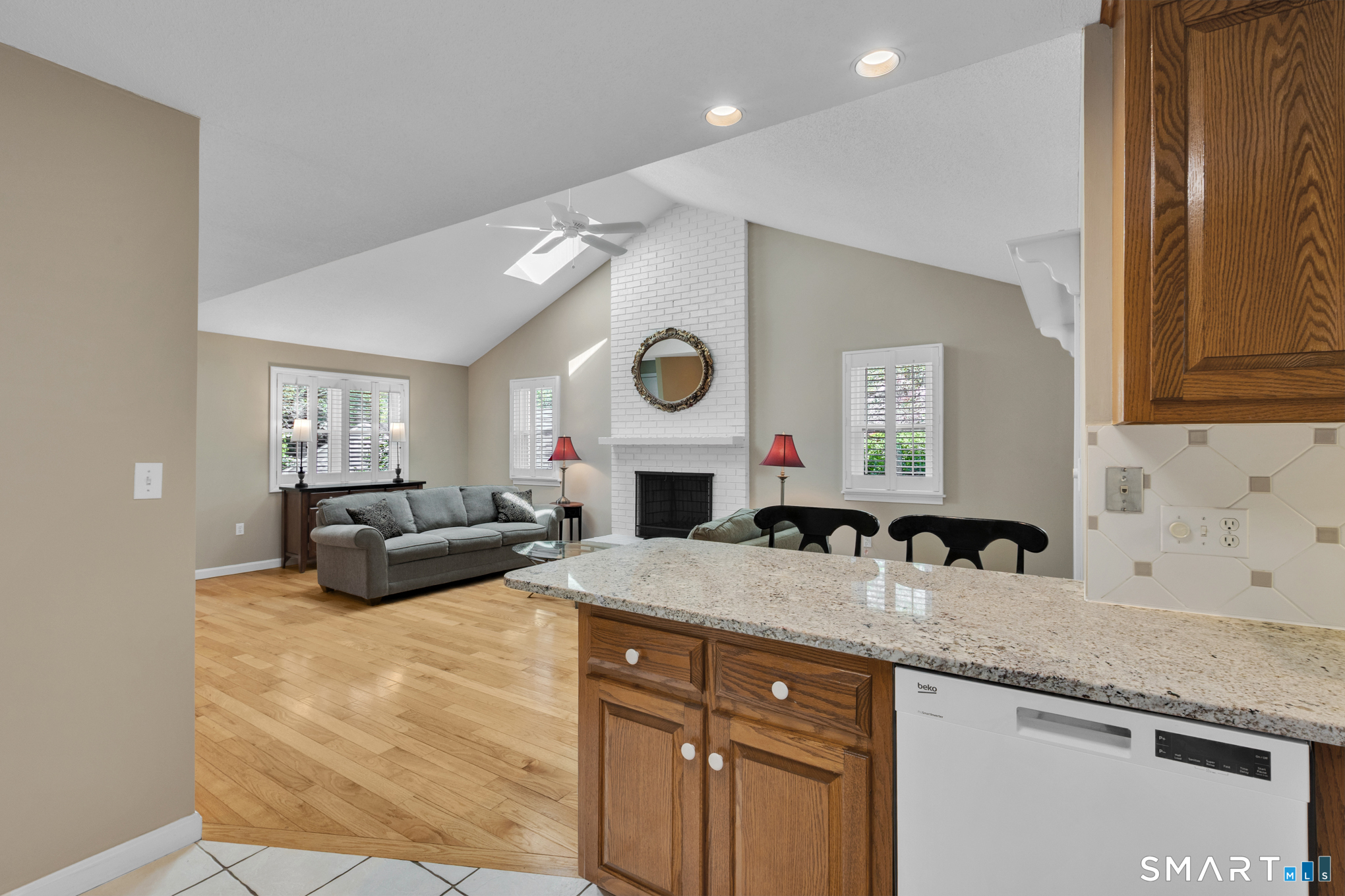 81 Oldefield Farms Road, Unit 81 Enfield, CT 06082 - Photo 11 of 35 a living room with granite countertop furniture and fireplace