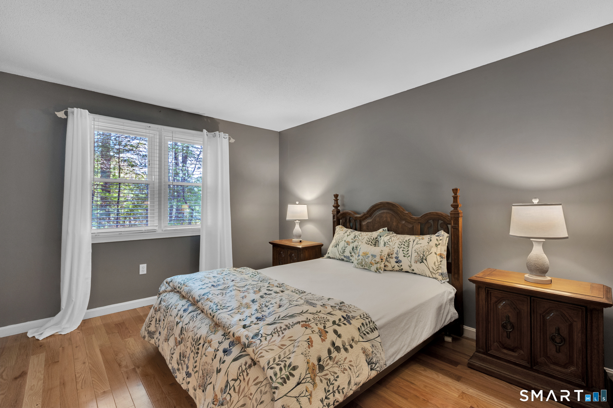 81 Oldefield Farms Road, Unit 81 Enfield, CT 06082 - Photo 22 of 35 a bedroom with a bed and a window