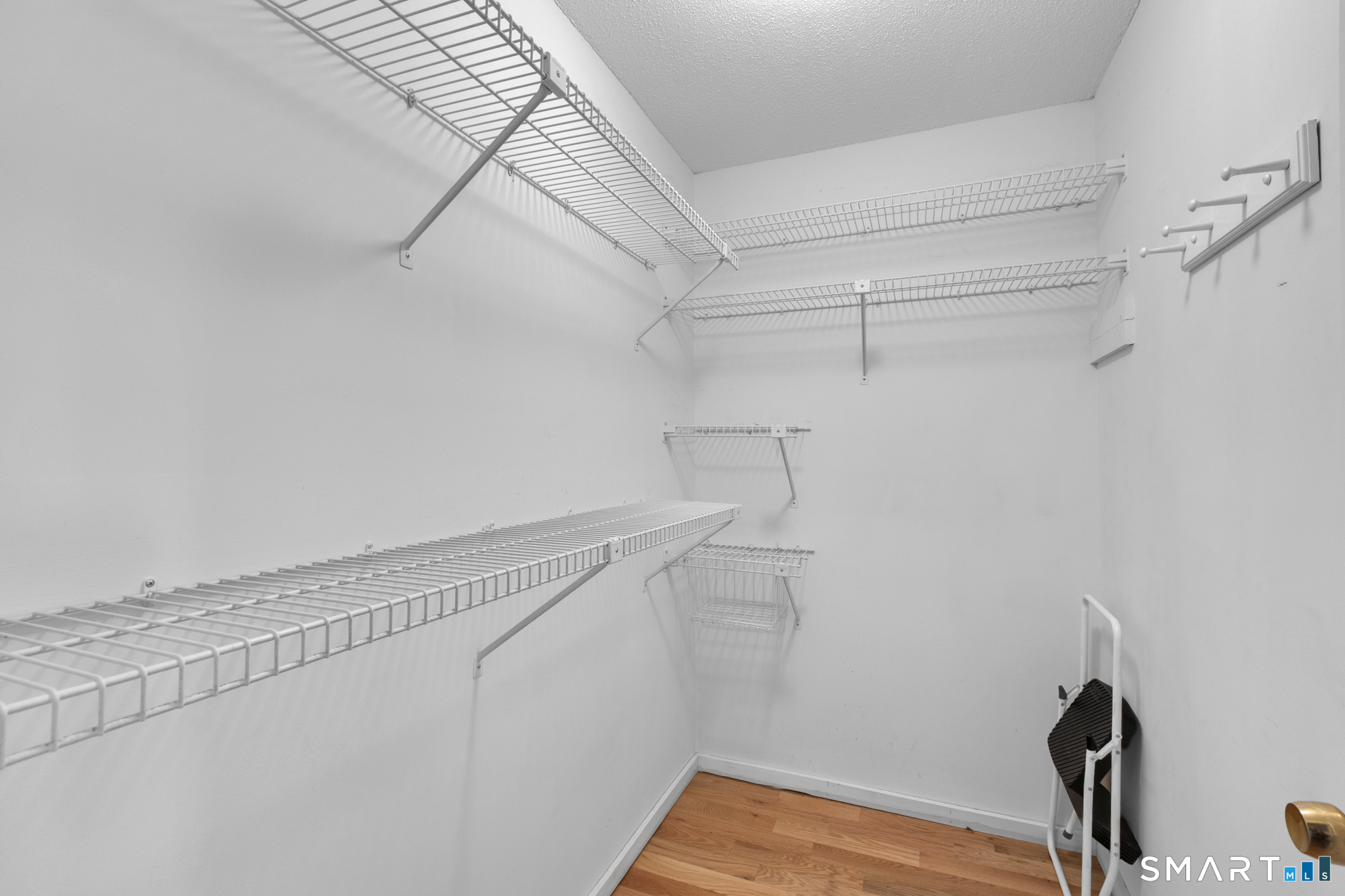 81 Oldefield Farms Road, Unit 81 Enfield, CT 06082 - Photo 24 of 35 a view of a room with racks on the wall