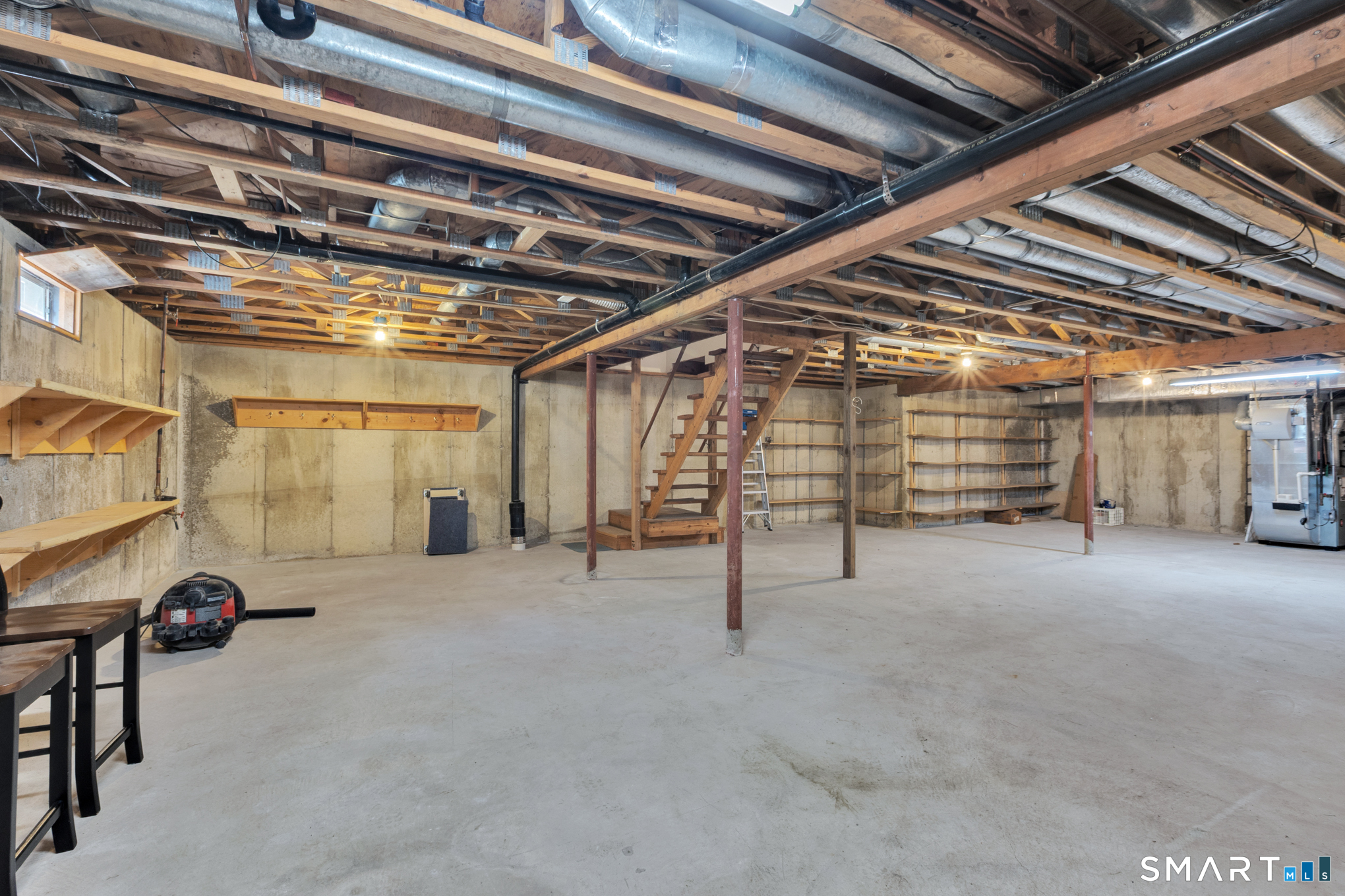 81 Oldefield Farms Road, Unit 81 Enfield, CT 06082 - Photo 28 of 35 a view of an empty room with gym equipment
