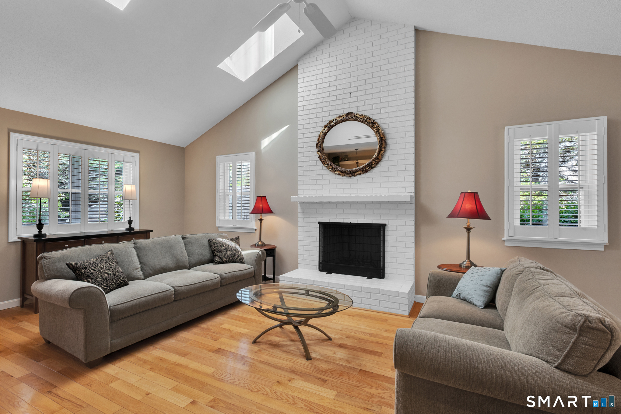 81 Oldefield Farms Road, Unit 81 Enfield, CT 06082 - Photo 4 of 35 a living room with furniture a rug and a fireplace