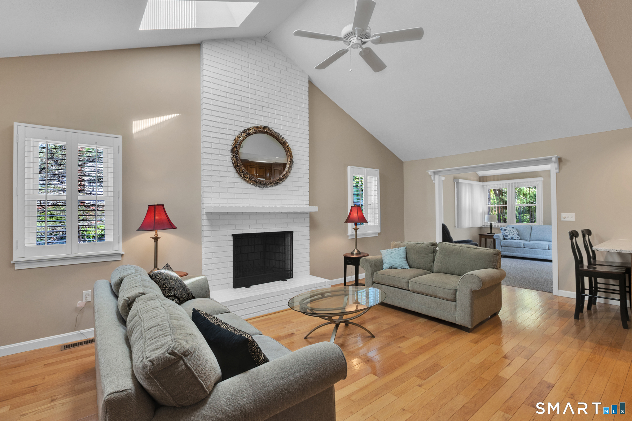 81 Oldefield Farms Road, Unit 81 Enfield, CT 06082 - Photo 5 of 35 a living room with furniture and a fireplace