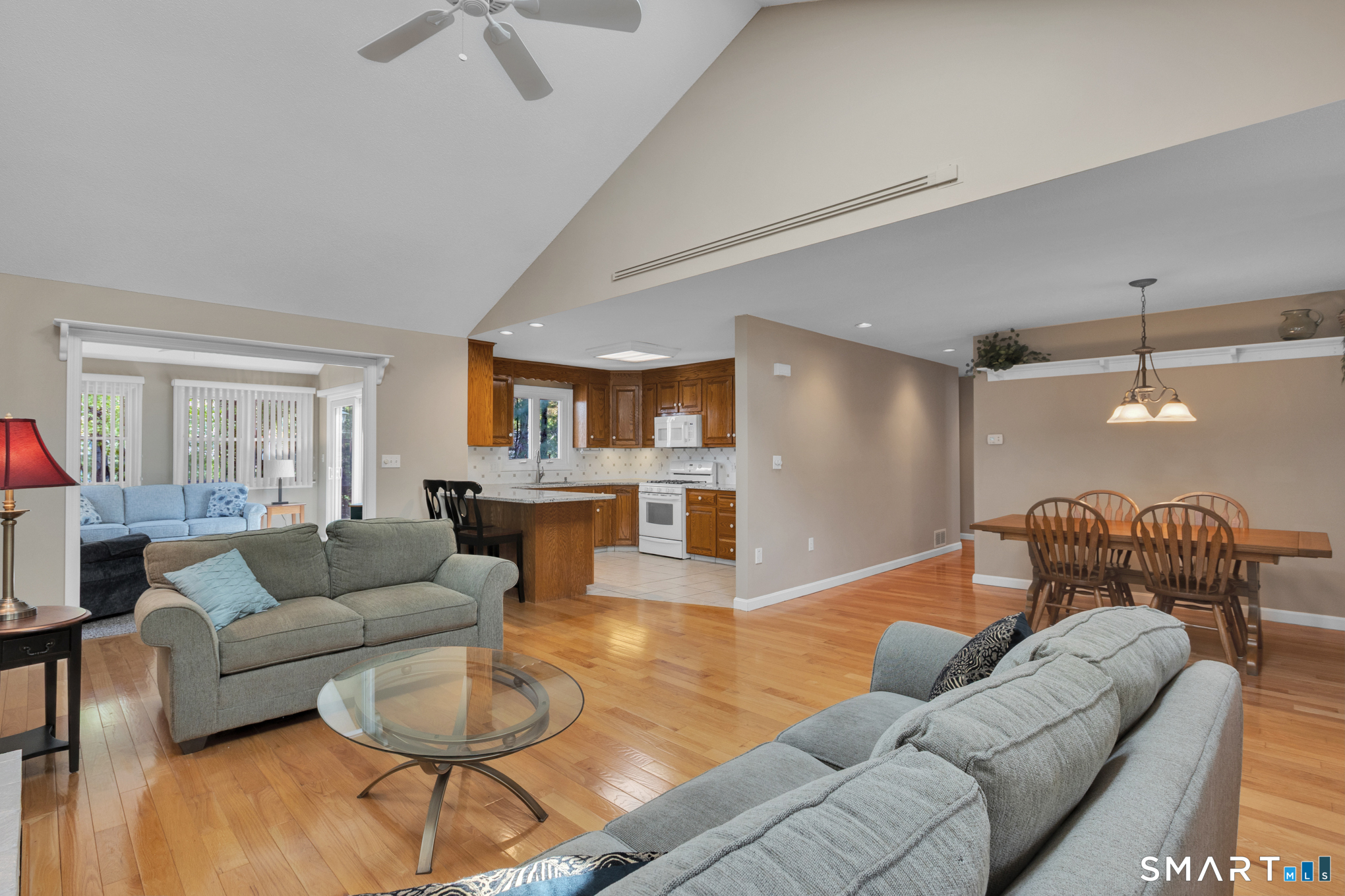 81 Oldefield Farms Road, Unit 81 Enfield, CT 06082 - Photo 7 of 35 a living room with furniture and a wooden floor