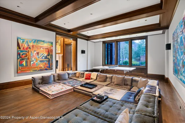 a living room with furniture and large window