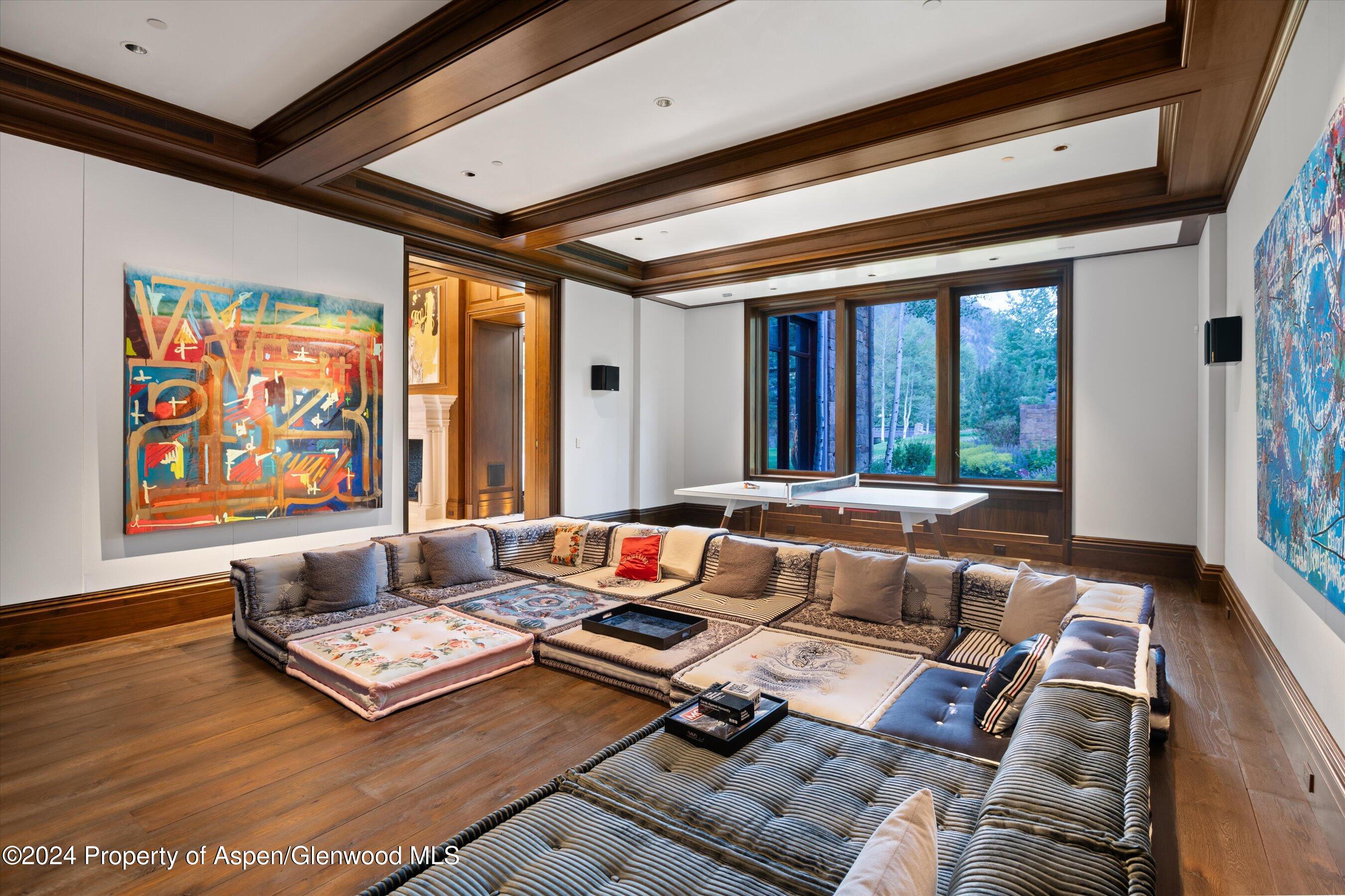41 Popcorn Lane Aspen, CO 81611 - Photo 11 of 54 a living room with furniture and large window