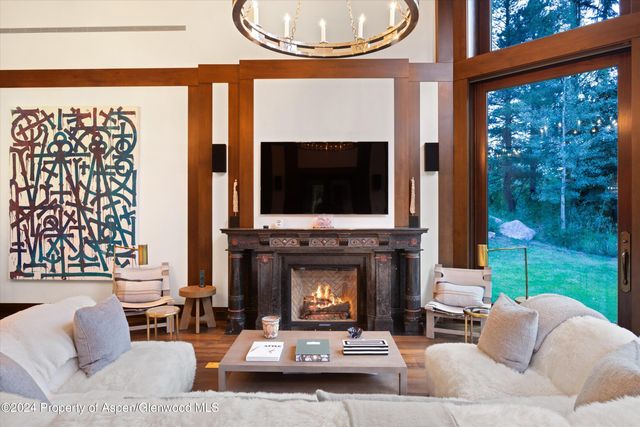 a large bedroom with a large bed and a large window