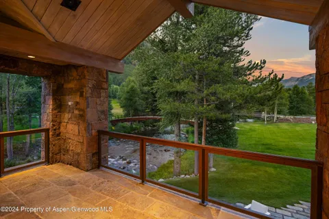 a living room with fireplace furniture and a window