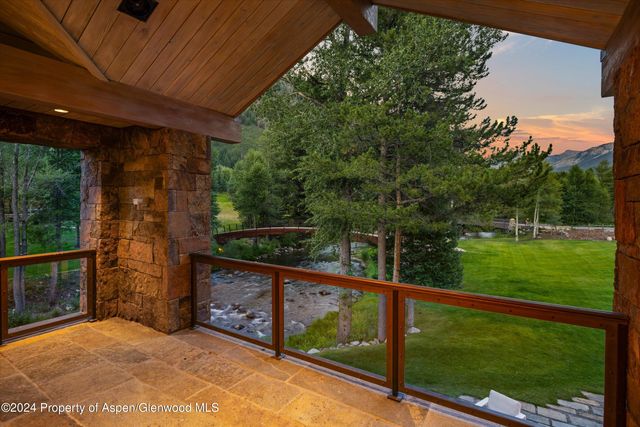 a living room with fireplace furniture and a window