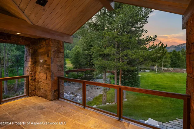 a living room with fireplace furniture and a window