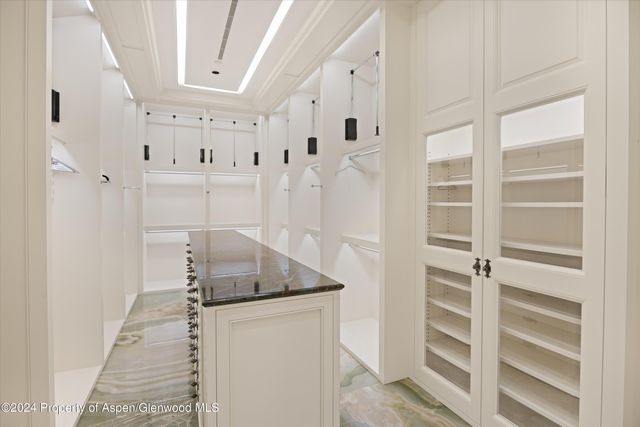 a living room with granite countertop furniture and flat screen tv