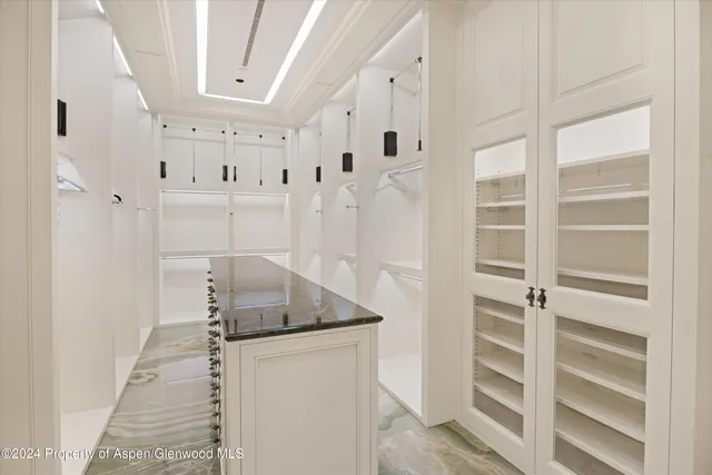 a living room with granite countertop furniture and flat screen tv