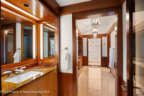a view of a kitchen with furniture and wooden floor